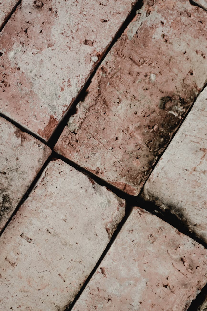 Close-up of tile spacing and grout application showing professional technique